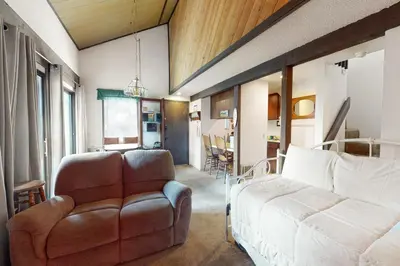 a living room with a couch and a chair at Hidden Valley 14 B in Mammoth Lakes