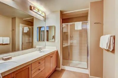 a bathroom with two sinks and a shower at Mammoth Green 219 in Mammoth Lakes
