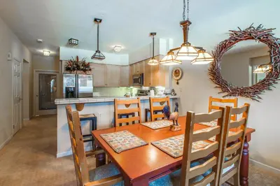 a kitchen and dining room with a table and chairs at Mammoth Green 110 in Mammoth Lakes