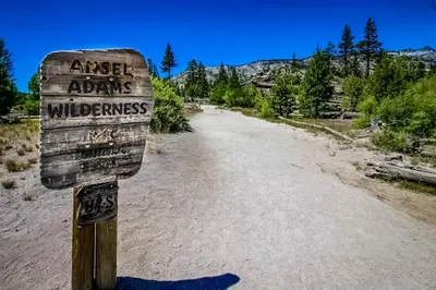 a sign on the side of a dirt road at Mammoth Green 110 in Mammoth Lakes