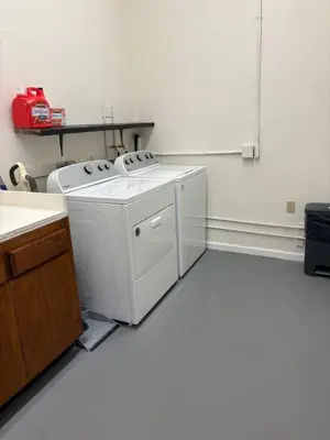 a washer and dryer in a kitchen with a counter at Newly Renovated Lakefront with Dock in Bethel Island