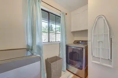 a small kitchen with a window and a stove at Scenic Yosemite Lakes Escape with Community Perks! in Coarsegold