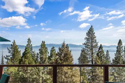 a view from the deck of a house with trees at Bella Casa - North Lake Tahoe in Tahoe City