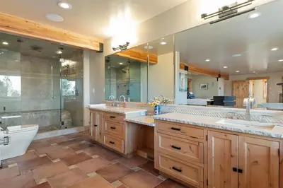 a bathroom with two sinks and a large mirror at Bella Casa - North Lake Tahoe in Tahoe City