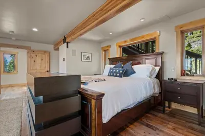 a bedroom with a large bed and a dresser at Bella Casa - North Lake Tahoe in Tahoe City