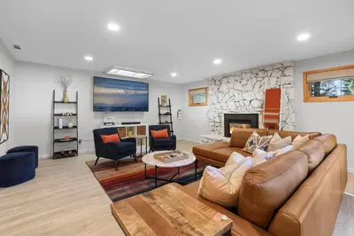 a living room with a couch and a fireplace at Stellars Jay Getaway Pet Friendly in City of SLT in South Lake Tahoe