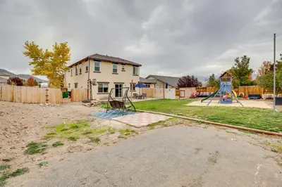 a yard with a playground in front of a house at Family-Friendly Retreat with Playground in Reno! in Reno