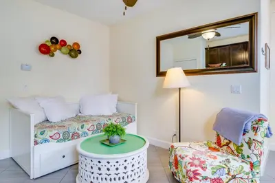 a bedroom with a bed and a chair and a table at Hike, Play and Unwind Charming Reno Unit in Reno