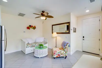 a living room with a bed and a chair at Hike, Play and Unwind Charming Reno Unit in Reno