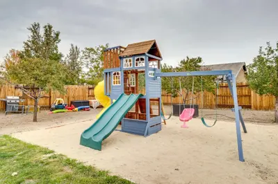 a playground with a slide and a play structure at Hike, Play and Unwind Charming Reno Unit in Reno
