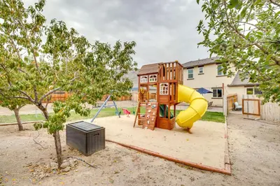 a playground with a slide in a yard at Hike, Play and Unwind Charming Reno Unit in Reno