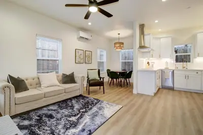 a living room with a couch and a kitchen at Modern Cozy and contemporary in Ione