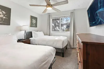 a hotel room with two beds and a window at Family 4BR Home with Patio by Willowcreek Park in Sparks