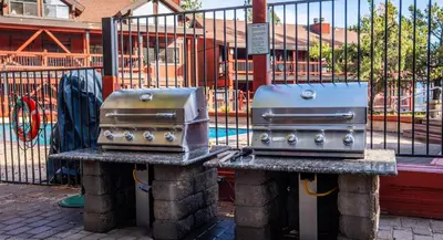 two burners sitting on a table next to a fence at Tahoe Edgelake Beach Club by Coolvacay in Tahoe Vista