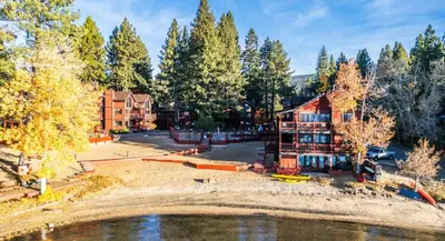 an aerial view of a house and a lake at Tahoe Edgelake Beach Club by Coolvacay in Tahoe Vista