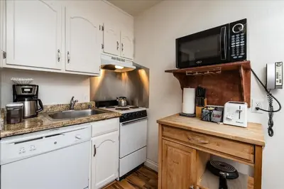 a small kitchen with a sink and a microwave at (A111) Studio Condominiums in Yosemite West