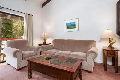 a living room with a couch and two chairs and a table at (A202) Loft Condominiums in Yosemite West