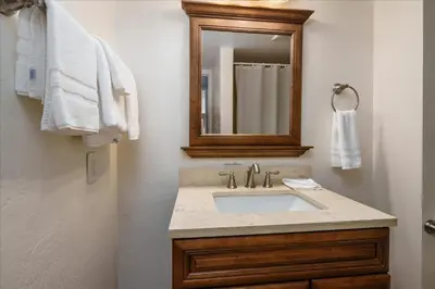 a bathroom with a sink and a mirror at (A202) Loft Condominiums in Yosemite West