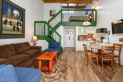 a living room with a couch and a table at (A204) Loft Condominiums in Yosemite West