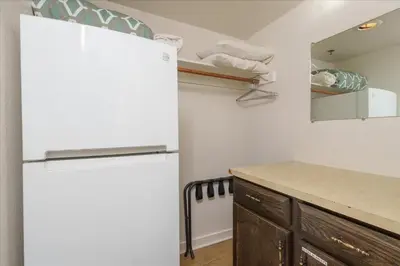 a kitchen with a white refrigerator and a counter at (A110) Studio Condominiums in Yosemite West