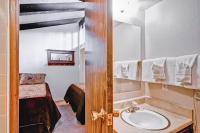 a bathroom with a sink and a mirror at (A203) Loft Condominiums in Yosemite West