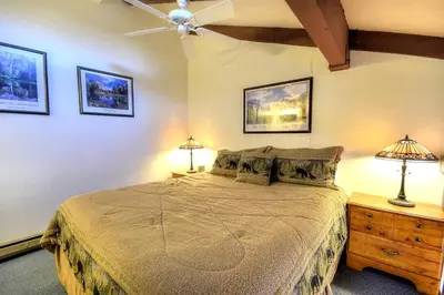 a bedroom with a bed and a ceiling fan at (A211) Loft Condominiums in Yosemite West