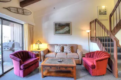 a living room with a couch and two chairs at (A211) Loft Condominiums in Yosemite West