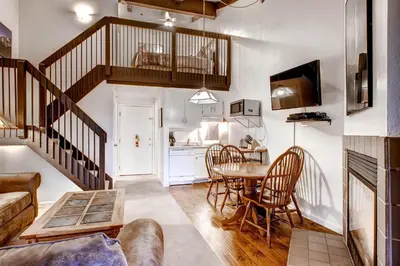 a kitchen and living room with a table and chairs at (B207) Loft Condominiums in Yosemite West