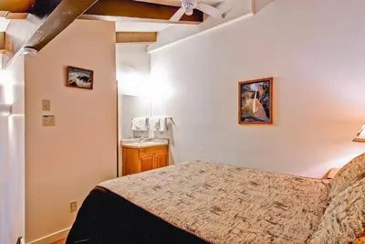 a bedroom with a large bed in a room at (B211) Loft Condominiums in Yosemite West