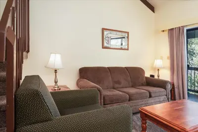 a living room with a couch and a table at (B208) Loft Condominiums in Yosemite West