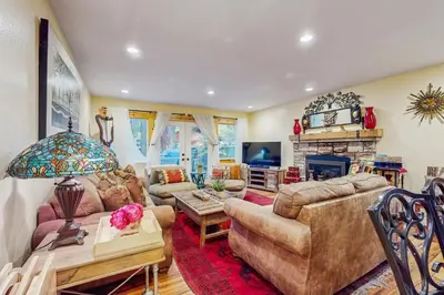 a living room with a couch and a fireplace at Colorado Pines Retreat in South Lake Tahoe