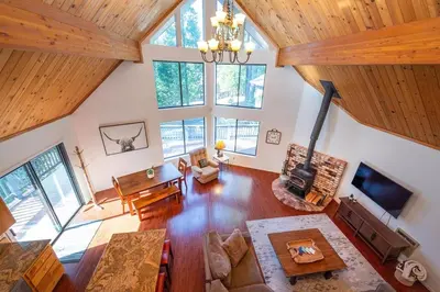 an overhead view of a living room with wood ceilings at Arnold A Frame Cabin with Hot Tub and Guest Suite in Arnold