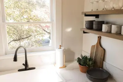 a kitchen counter with a sink and a window at Yosemite Cottage Retreat- Half Block to Downtown in Mariposa
