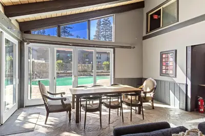 a dining room with a table and chairs at Chamonix #15 - Cozy Mtn Retreat with Fireplace in Mammoth Lakes
