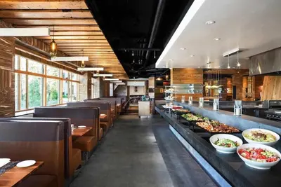 a restaurant with a buffet line with plates of food at Hillside #508 - Cozy Studio w King Bed Fireplace & Kitchenette in Mammoth Lakes