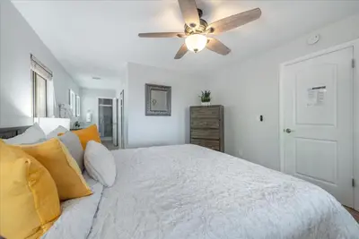 a bedroom with a bed with a ceiling fan at Martis Landing home in Truckee