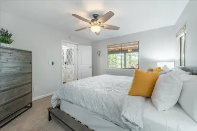 a bedroom with a bed and a ceiling fan at Martis Landing home in Truckee