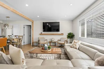 a living room with a couch and a table at Luxury Hyatt Oasis 3 Bedrms 1 Bath SFH for Fun Ski home in South Lake Tahoe