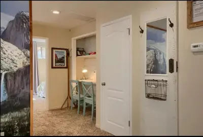 a room with a door and a room with a desk at Hillside Bungalow - Walking distance to downtown in Mariposa
