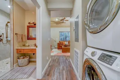 a laundry room with a washer and dryer in a house at Butterfly View Retreat - 45 Min to Yosemite in Mariposa
