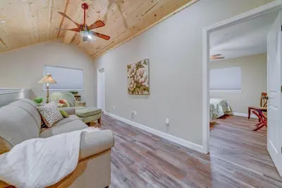 a living room with a couch and a ceiling fan at Butterfly View Retreat - 45 Min to Yosemite in Mariposa