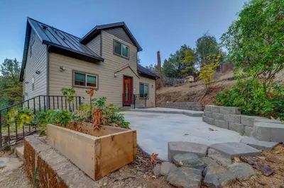 a house with a yard with a concrete driveway at Butterfly View Retreat - 45 Min to Yosemite in Mariposa