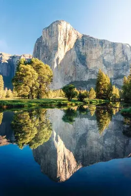 a mountain with its reflection in the water at Ely Farm House - Near Yosemite National Park in Oakhurst