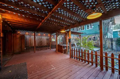 a wooden deck with a frisbee in the air at Tahoe Heavenly Hideaway 1060H in South Lake Tahoe