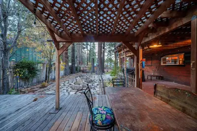 a wooden deck with a wooden table and benches at Tahoe Heavenly Hideaway 1060H in South Lake Tahoe