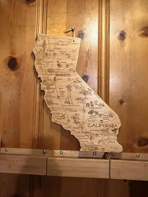 a map of california hanging on a wooden wall at Tahoe Heavenly Hideaway 1060H in South Lake Tahoe