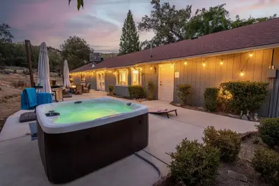 a hot tub in the backyard of a house at Moonrise Retreat, SPA, Near Yosemite & Bass Lake in Oakhurst