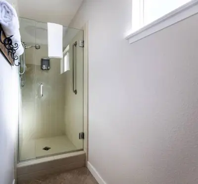 a shower with a glass door in a bathroom at Moonrise Retreat, SPA, Near Yosemite & Bass Lake in Oakhurst