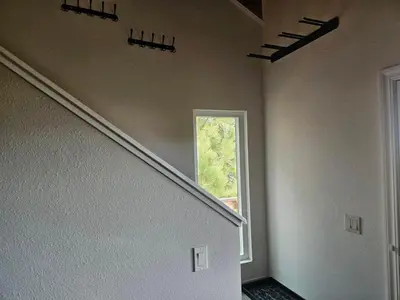 an empty room with a staircase and a window at Heavenly Stagecoach Ski Retreat in Stateline