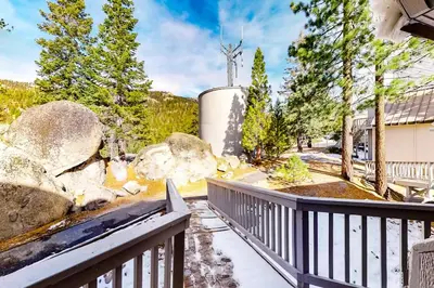 a balcony of a house with rocks and trees at Eagle's Nest in Big Creek